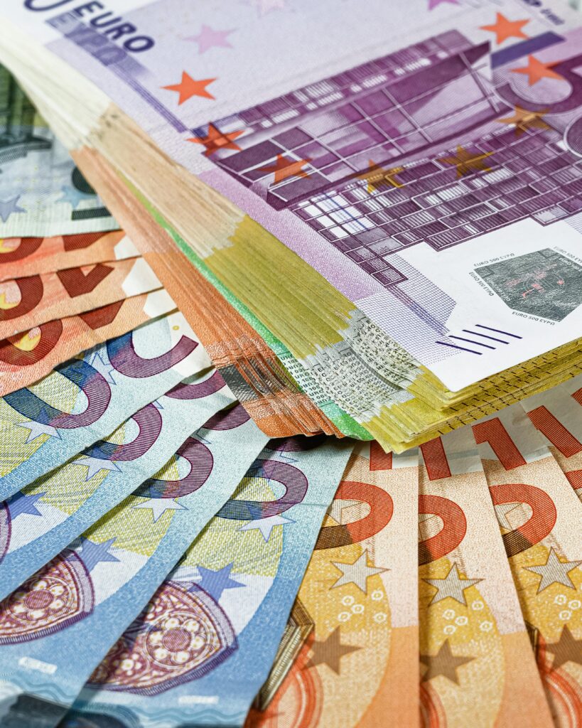 Close-up shot of European Union currency, showcasing euro banknotes in multiple denominations.
